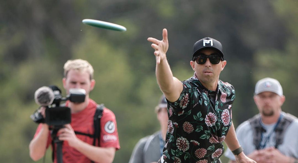 Paul McBeth playing disc golf and wearing Black Shades sunglasses